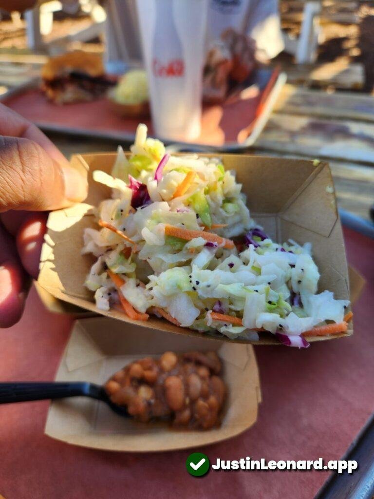 Closeup of pinto beans and coleslaw from Caldwell County BBQ in Gilbert Arizona