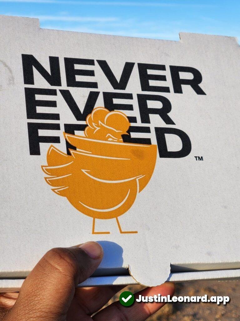 Sneaky Bird Review: To-go box showing "never ever fried" slogan 